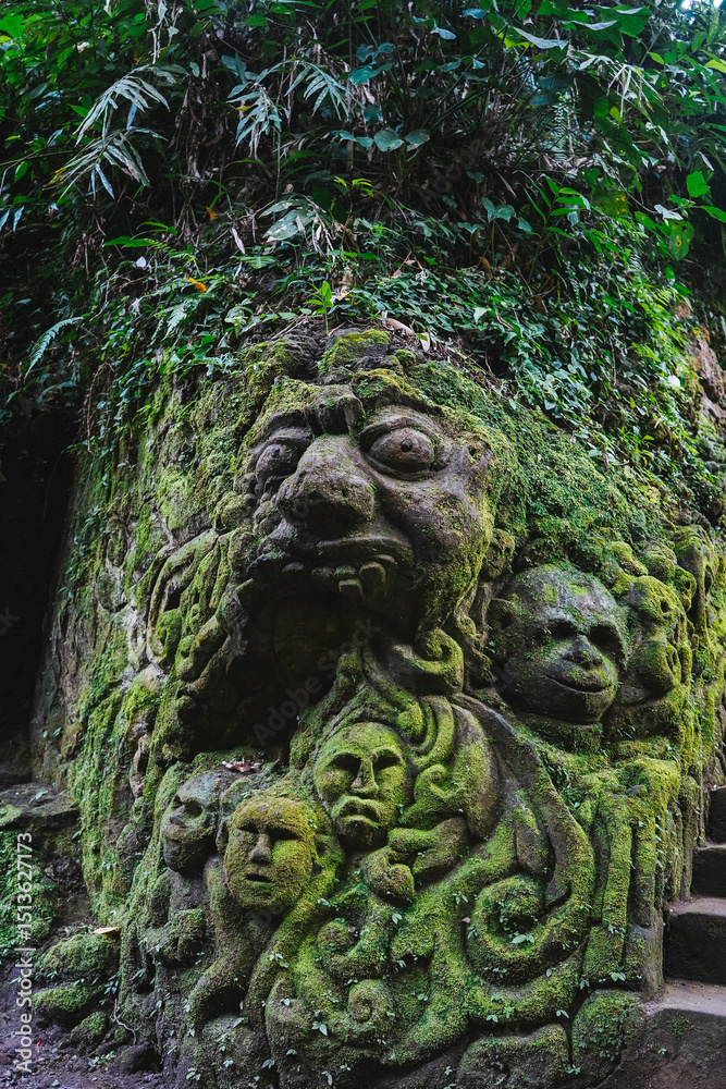 custom made wallpaper toronto digitalA moss-covered stone sculpture in a tropical jungle in Bali, Indonesia