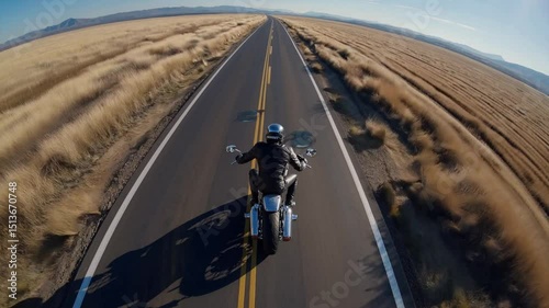 Motorcycle wheelie on open road