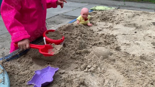 child playing with sand