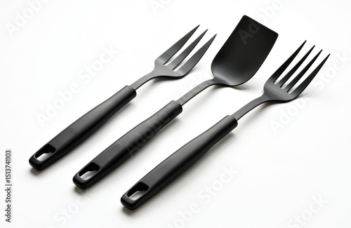 Set of black kitchen utensils spatula, slotted spatula, fork on white background. Ideal cooking preparation tools for chef. Modern design cutlery, essential for meal prep.
