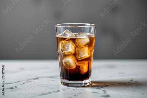 Ice Cold Refreshment: A refreshing glass of cola with ice cubes is the perfect drink for any occasion.