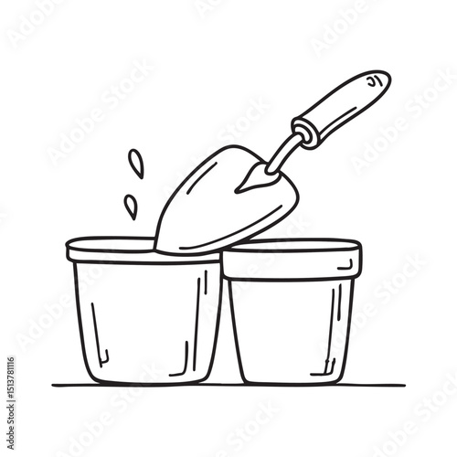 A trowel beside a flower pot