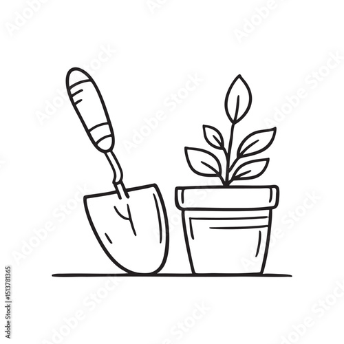 A trowel placed beside a flower pot