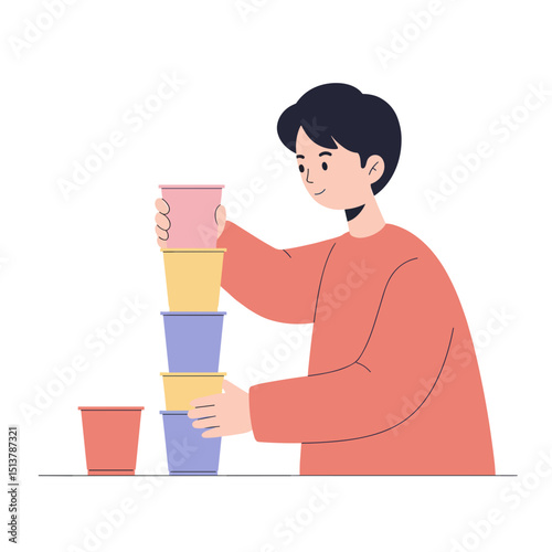 Boy stacking plastic cups in playful manner at indoor setting  