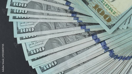 Camera flyover of $100 bills. Dollars. Hundred dollar bills.