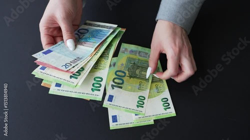 Women's hands counting banknotes. Euro money