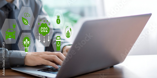 A business person using laptop with ESG environment social governance investment business concept, co2 on visual screen.