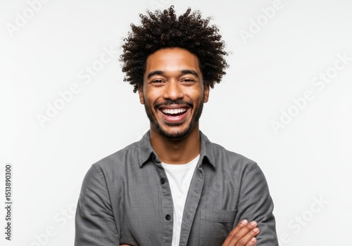 Happy young man with afro smiling broadly