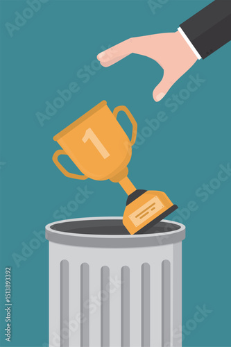Businessman hand throws winner cup into trash can. Abandonment of leadership, heavy burden of responsibility and decisions. Fatigue from victories and first place.