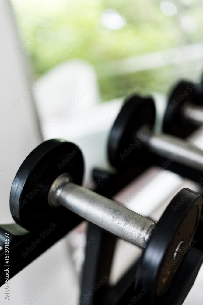 Fototapeta premium Close up of metal dumbbells. Fitness gym training sport equipments concept.