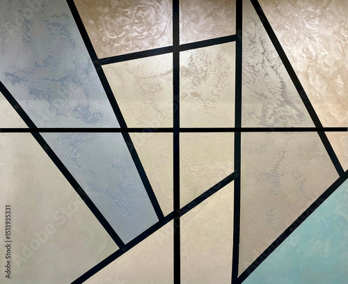Abstract geometric wall design featuring pastel colors and diagonal shapes in a modern interior setting