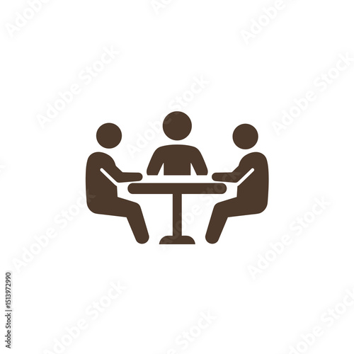 Three people engaged in discussion around a table  