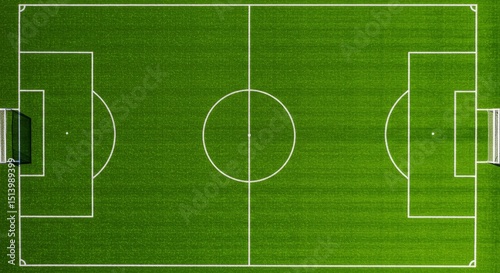 Aerial View of Soccer Field 2025-05-18 - Green grass, white lines, two goals, center circle, penalty areas; symbolizing sport, competition, teamwork, strategy, victory