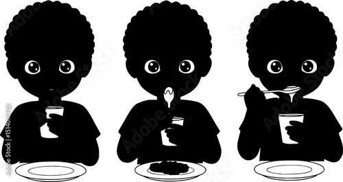 Happy child eating with a spoon. boy in black
