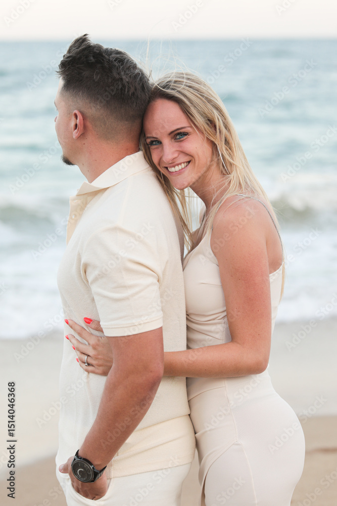 Fototapeta premium Young happy traditional couple in love in summer at sea on the beach. Love. Family.