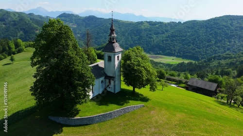 A church on the sunny hill, Slovenia, Sv. Tomaž, drone video, aerial footage