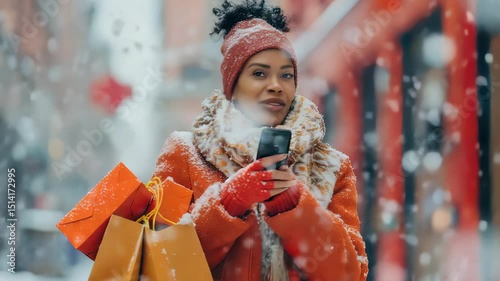 Woman with shopping bags using her phone in the snow. She is wearing winter clothes. The background has buildings and it is snowing.