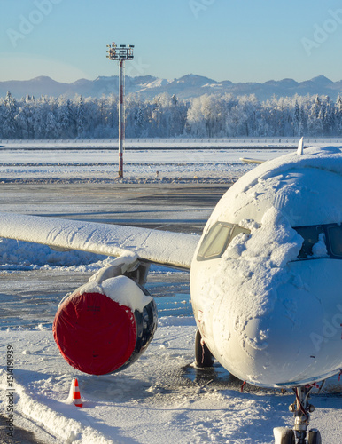 grounded airplane in the snow