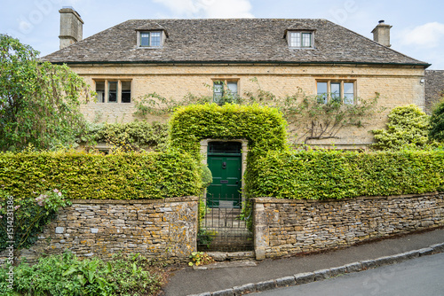 Fototapeta Naklejka Na Ścianę i Meble -  House in Upper Slaughter, Cotswold district of Gloucestershire, England, UK