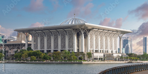 Exterior view of Tuanku Mizan Zainal Abidin Mosque, aka Iron Mosque, in Putrajaya, Malaysia, by the lake. A modern Islamic architecture landmark