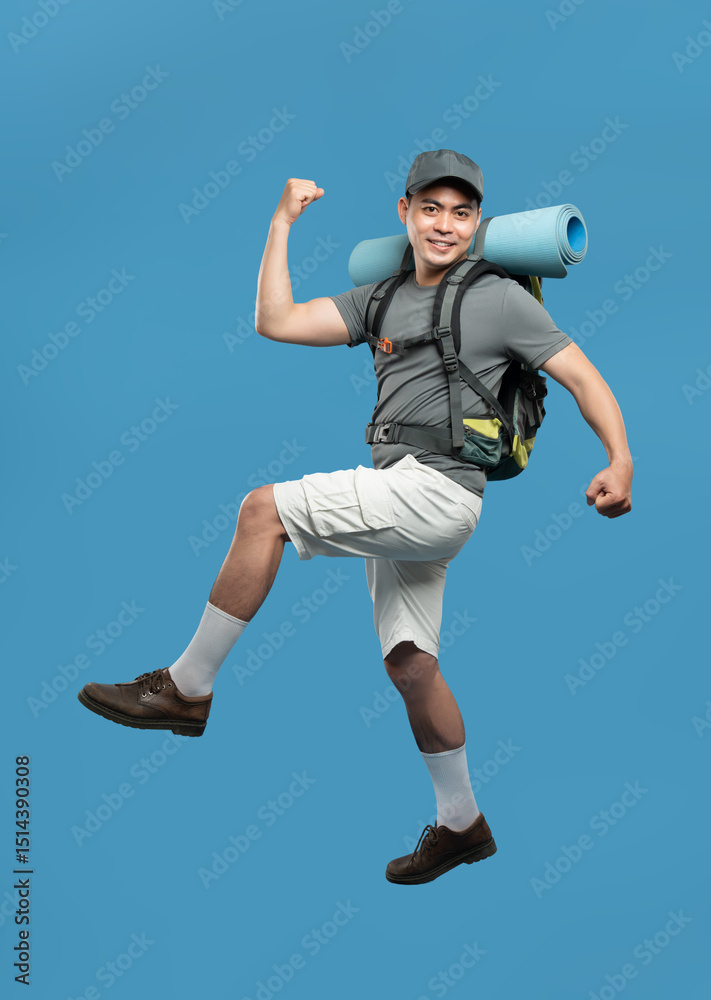 Obraz premium Energetic hiker strikes a victorious pose ready for outdoor adventures with his gear Hiker is celebrating