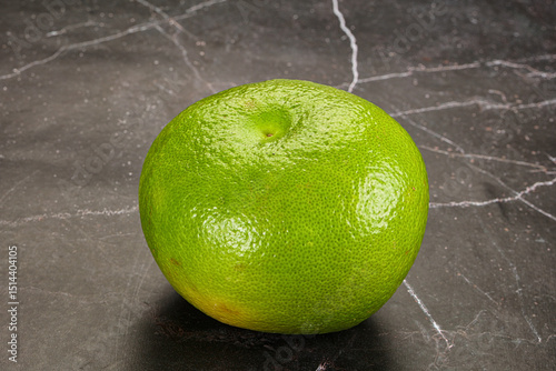 Fototapeta Naklejka Na Ścianę i Meble -  Green ripe fruit sweetie citrus