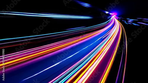 Light streaks and trails captured in long exposure photography in a dark tunnel. photo