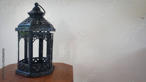a rustic metal candle lantern part of a decor theme