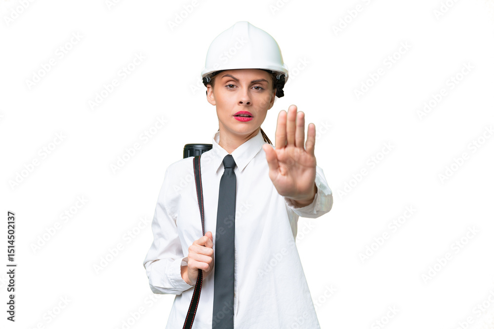 Young architect woman with helmet and holding blueprints over isolated background making stop gesture Young architect woman with helmet and holding blueprints over isolated background making stop gesture