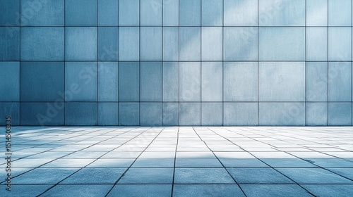 Blue tiled wall with a tiled floor reflecting light in an urban outdoor setting during the day