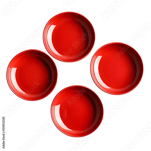 Four red ceramic bowls arranged symmetrically on a black background from above