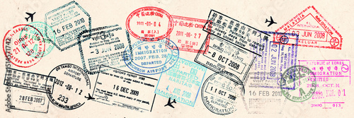 Passport visas stamps on sepia textured, vintage travel collage background