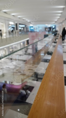 Wallpaper Mural Modern indoor shopping center interior with glass railings, bright lighting, and people visible in the distance within an expansive retail environment. Torontodigital.ca