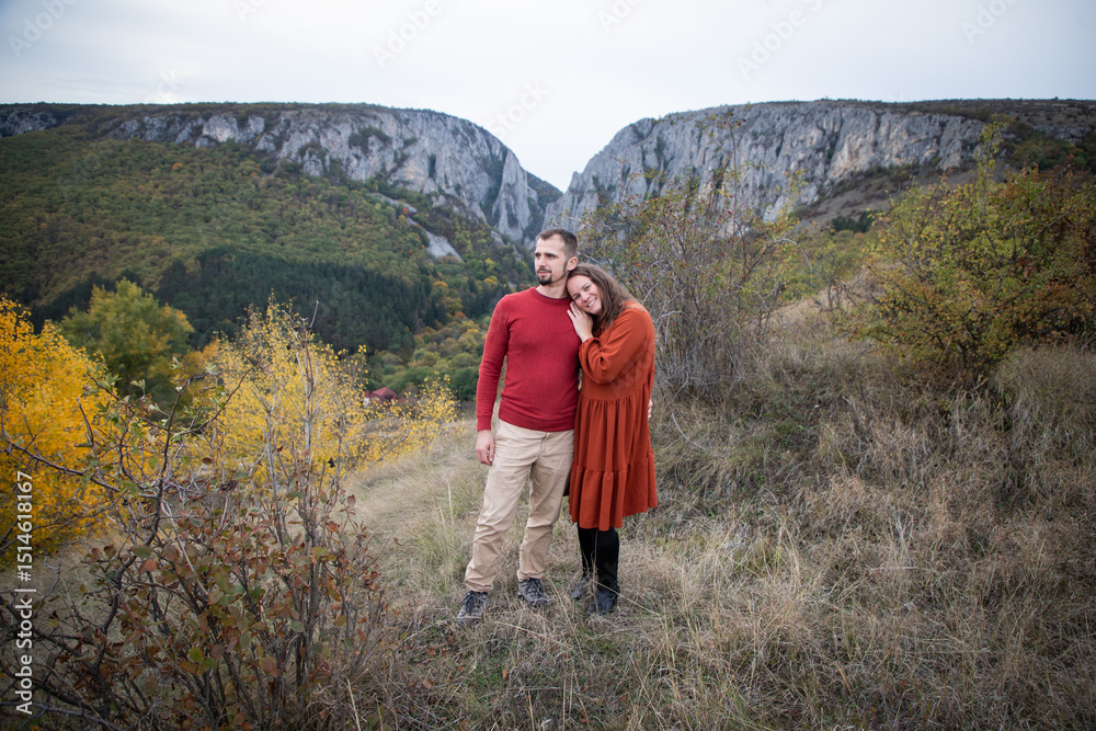 Fototapeta premium happy young couple posing outdoors in autumn