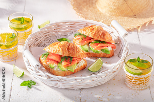 Healthy and homemade french croissant with fish and avocado.
