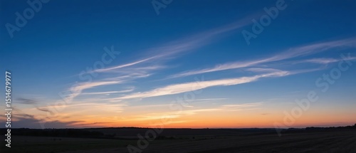 Panorama view of dark blue sunset sky with cirrus clouds