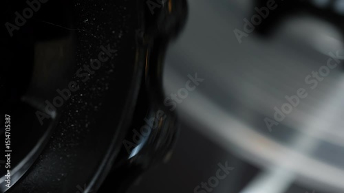 Macro detail of black bicycle gear and bearing.
