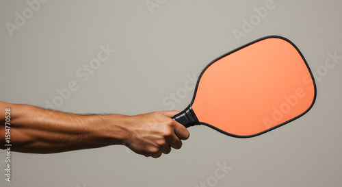 Studio Shot of Hand Gripping Pickleball Paddle