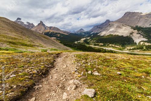 Hiking trail to Parker Ridge. Narrow path in the mountains. The Rocky Mountains. Banff National Park, Alberta, Canada