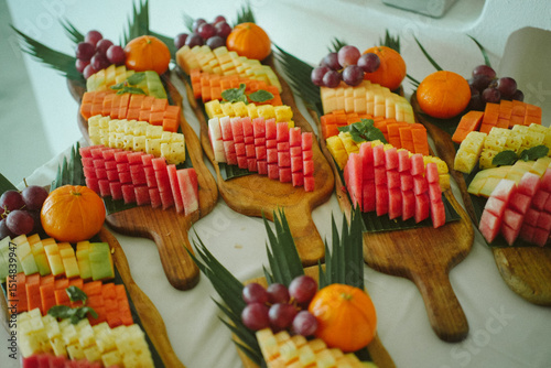 Elegant fruit platter with tropical sliced fruits, arranged for luxury hotel breakfast or catering service