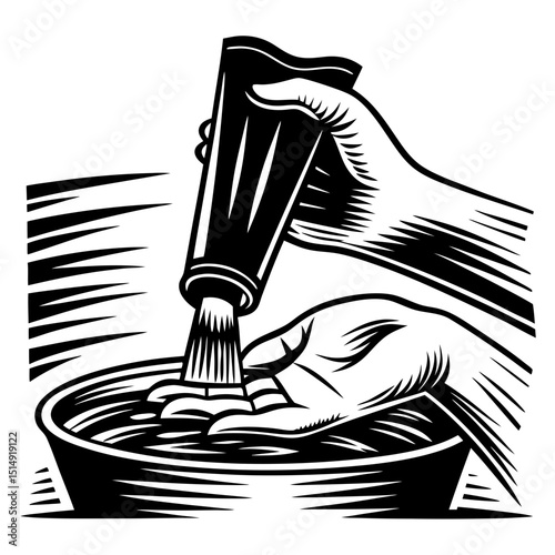 Hand squeezing tube of substance into bowl