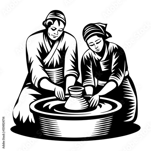 Two women pottery artists at work on a wheel