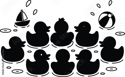 Group of black rubber ducks floating with a sailboat and beach ball
