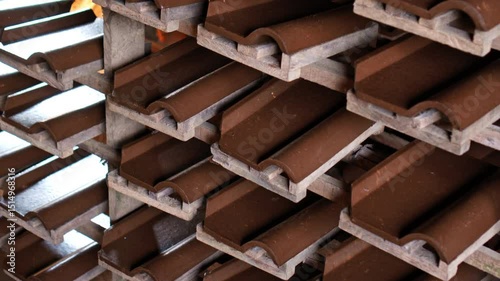 An Indonesian factory producing red clay roof tiles using ancient technology on the island of Bali.