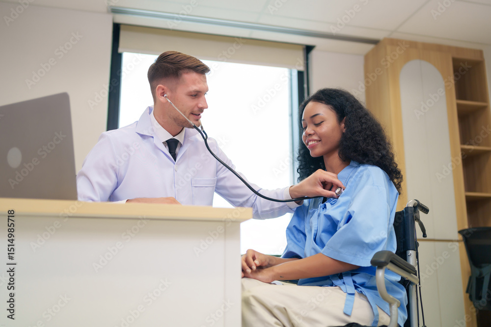 Fototapeta premium caucasian doctor in white gown using stethoscope to listen heart beat an afro hair woman client in examine room at hospital