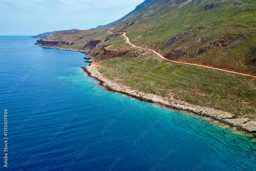 Dirt road to Balos Bay along cliff edge, Crete Dirt road to Balos Bay along cliff edge, Crete