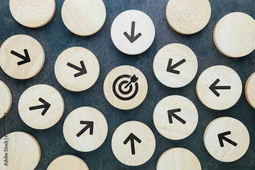 Every arrow wood block points at the same target at the center, all for one purpose, teamwork, business competition, or the  point of communication concept