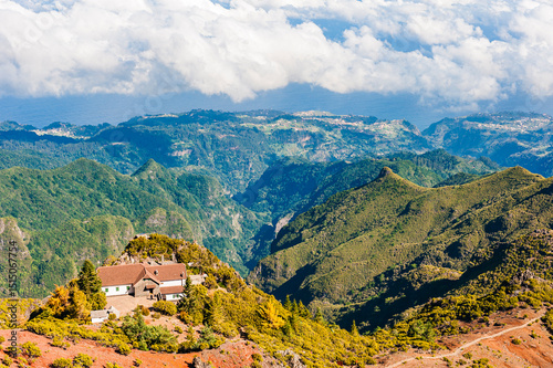 Wallpaper Mural Stunning mountain landscape of Madeira showcasing lush hills and distant valleys under a blue sky Torontodigital.ca