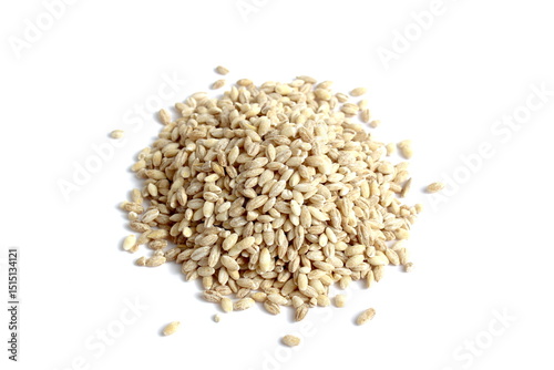 There is a small pile of pearl barley on a white background.