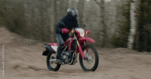 Rider skillfully navigating an OffRoad Motorcycle while exploring a scenic Forest Trail